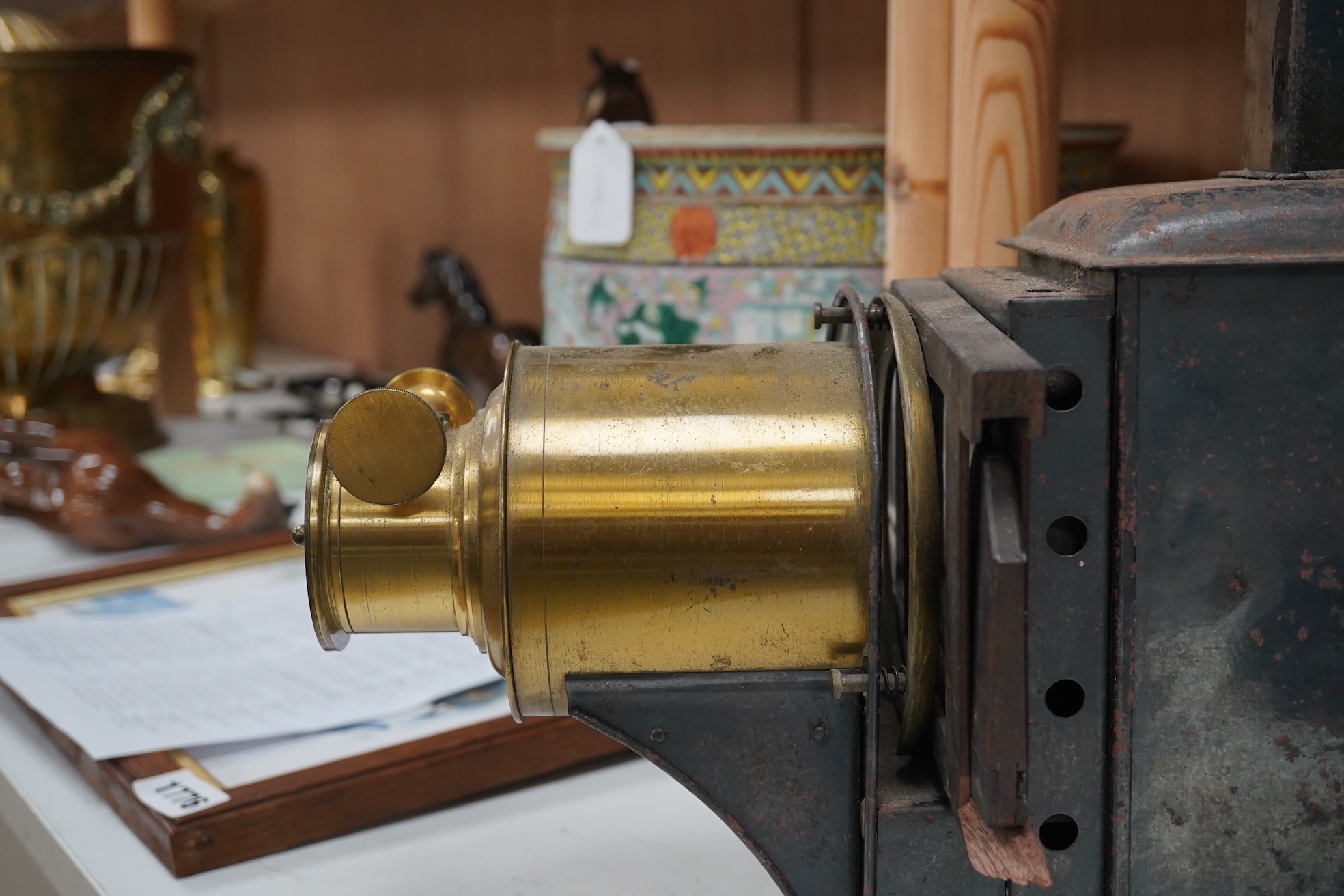 A 19th century magic lantern slide projector, 43cm deep. Condition - black metal rusty